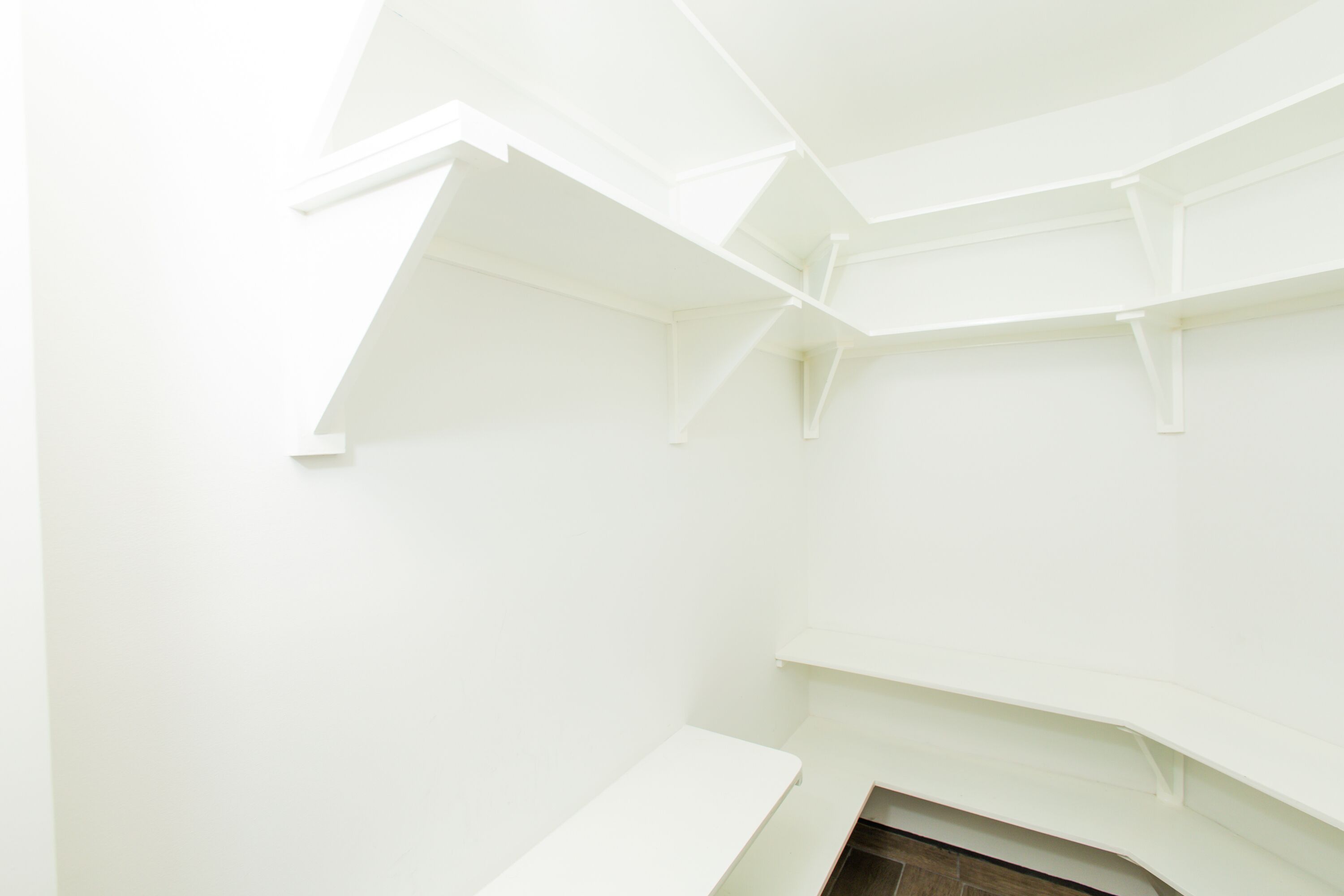 A room with white walls and a simple, modern design.