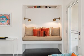 TV, fireplace, books