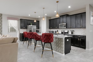 Kitchen fully equipped with seating