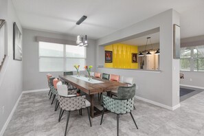 Dining area with large table seating 12 comfortably - Large resort style single family home with pool and hot tub, minutes from Disney (Four Corners)