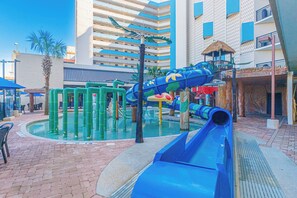 A water park area with slides and play structures. - Ocean Reef 1503 (Myrtle Beach)