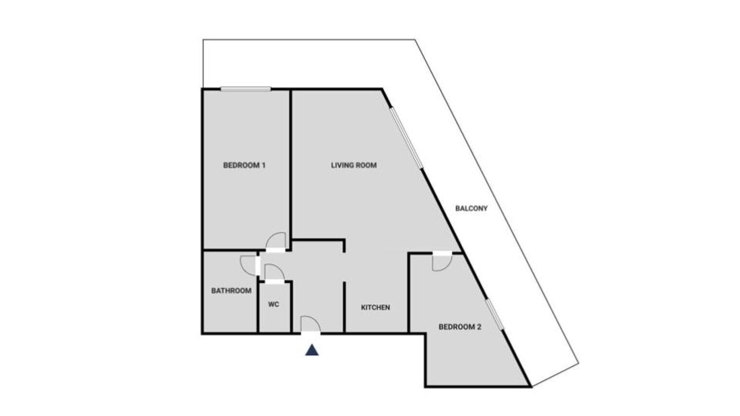 A floor plan with two bedrooms, a living room, a balcony, a bathroom, a WC, and a kitchen.