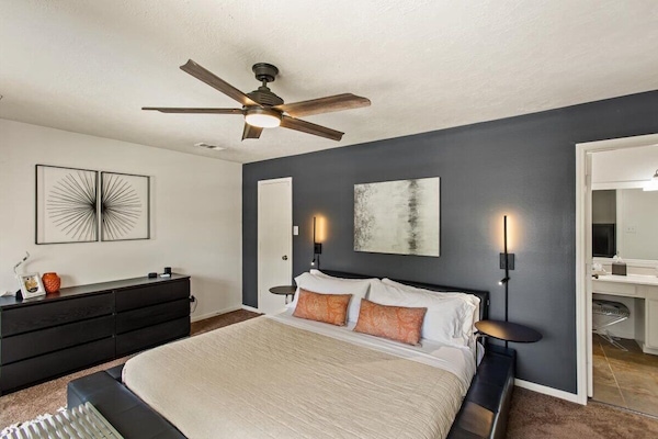 Large primary bedroom with soft contemporary styling. Private on-suite.