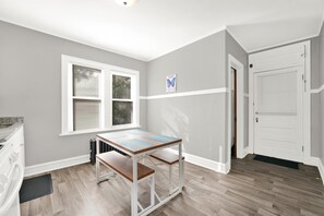 Enjoy a peaceful retreat with a single window, small table, and comfortable benches.