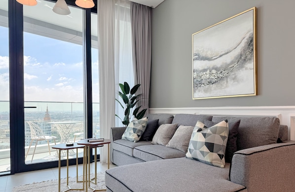 Premium Apartment, 1 Bedroom | Living area | 55-inch Smart TV with cable channels, TV - Aya - Ideal 1BR Apartment in the Heart of new Dubai (Dubai)