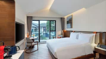Habitación Deluxe | Ropa de cama de alta calidad y minibar con artículos gratuitos