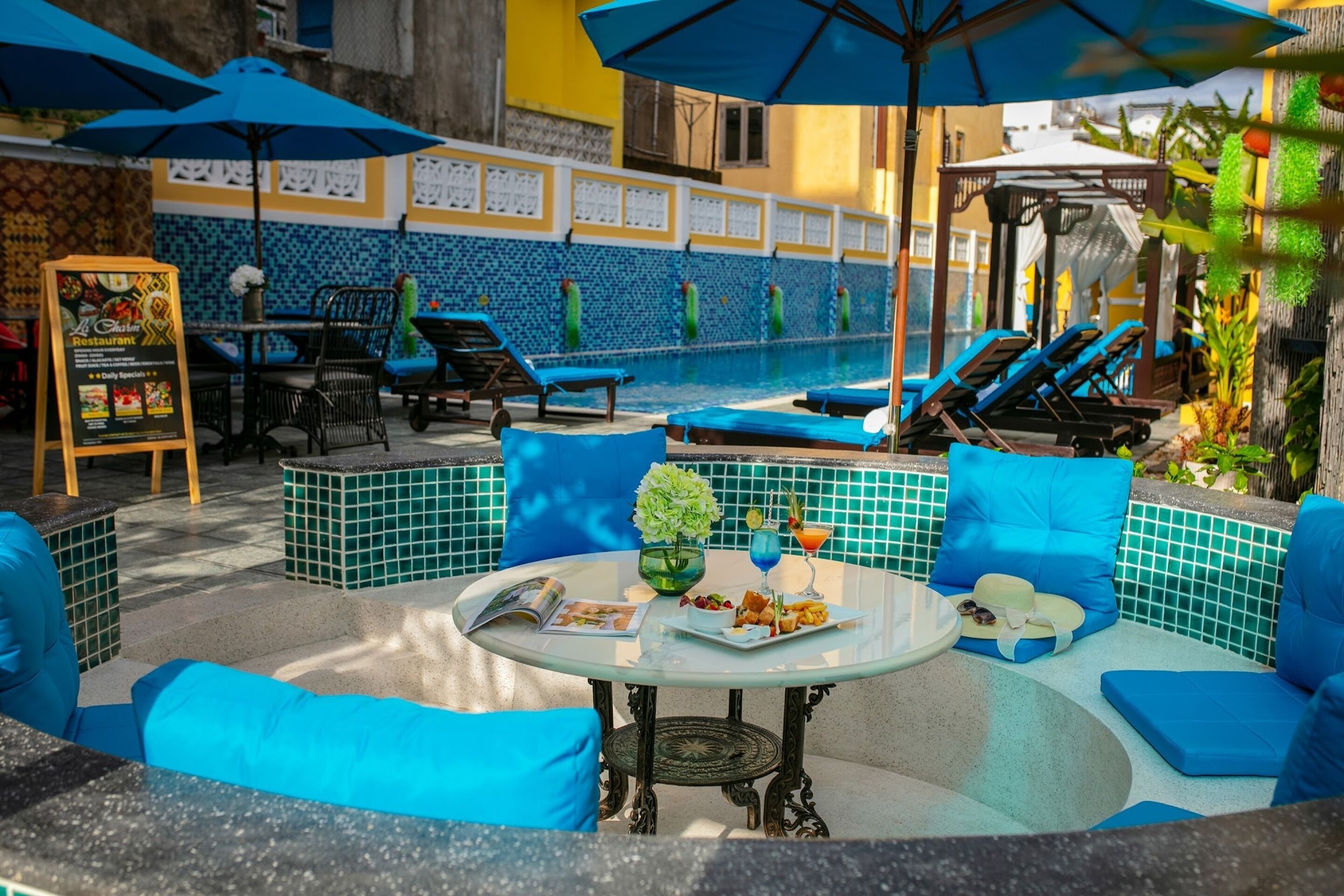 Outdoor pool, open 6:30 AM to 9:30 PM, pool umbrellas
