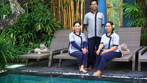 A poolside area with wicker lounge chairs, a small pool, and lush greenery in the background. - Rent a Luxury Villa in Bali Close to the Beach, Bali Villa 2016 (Seminyak)