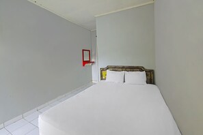 Laptop workspace, bed sheets