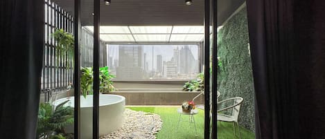 Executive Suite with Outdoor Cave Jetted Hot Tub | Bathroom | Shower, hair dryer, towels, soap