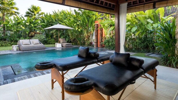 A poolside area with two lounge chairs, a sofa, and a small table. - Modern 4BR Villa W/ Pool & Balcony, Bali Villa 2220 (Kerobokan)