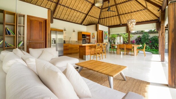 A spacious living area with a sofa, a wooden coffee table, and a dining set. - Fantastic 3BR Villa W/ Pool & Garden, Bali Villa 2228 (Ungasan)