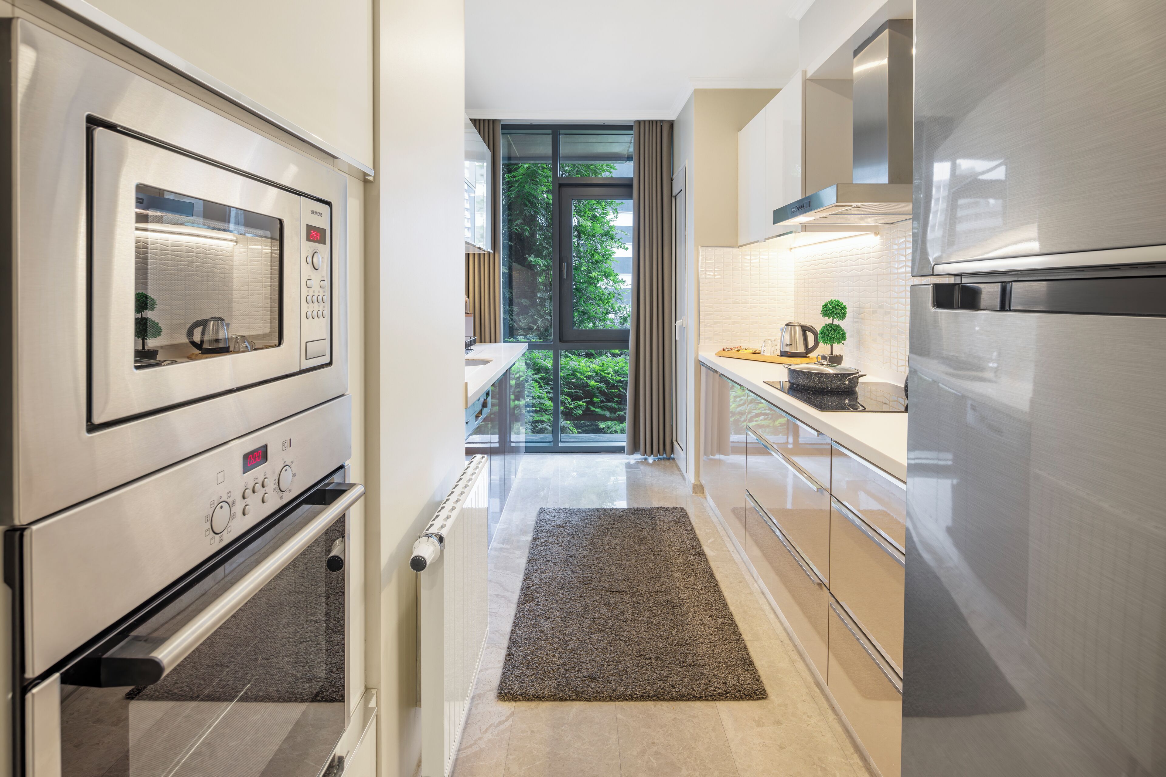 Deluxe Apartment, 3 Bedrooms, Balcony | Minibar, desk, laptop workspace, blackout drapes