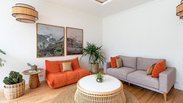 A living room with two sofas, a coffee table, and a large plant. - Elegant 2BR Villa W/ Pool, Bali Villa 2221 (Canggu)