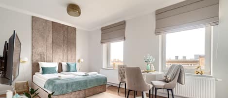 Departamento | 1 habitación, tabla de planchar con plancha, wifi gratis y ropa de cama