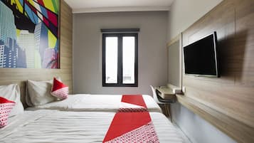 Habitación doble Deluxe | Escritorio, espacio para trabajar con laptop y cortinas blackout