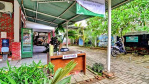 A hotel reception area with a sign reading "Hotel Syariah" and a reception desk labeled "RECEPTION." - OYO 90222 Lafa Park Syariah (Cikarang)