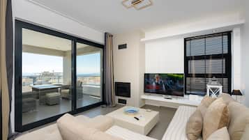 Deluxe Apartment | Living area | 55-inch Smart TV with digital channels, TV, Netflix