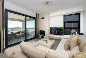 Deluxe Apartment | Living area | 55-inch Smart TV with digital channels, TV, Netflix - Flat with stunning views & prv parking (Glyfada)