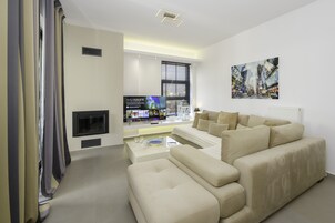 Deluxe Apartment | Living area | 55-inch Smart TV with digital channels, TV, Netflix