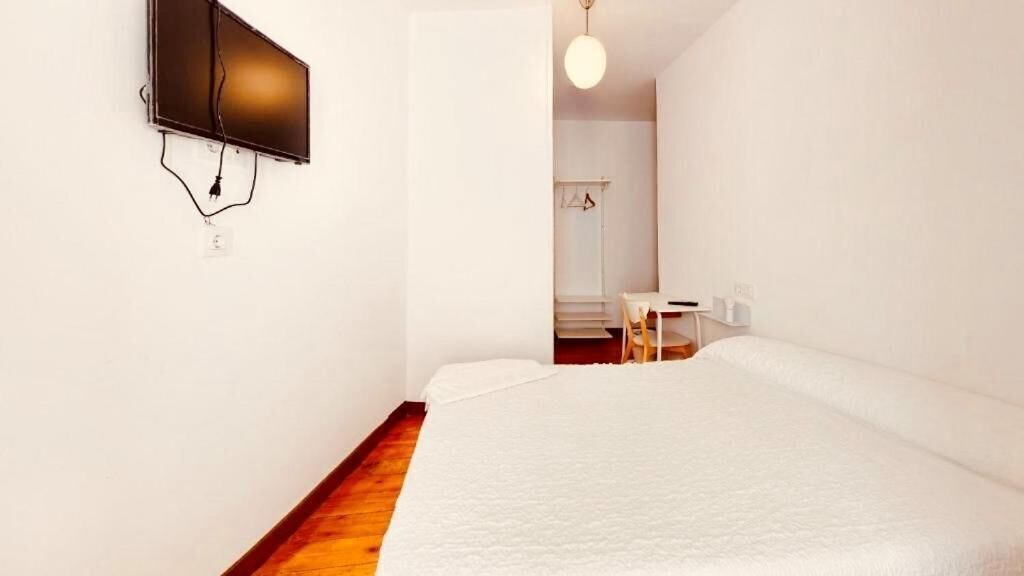 Desk, laptop workspace, free WiFi, bed sheets
