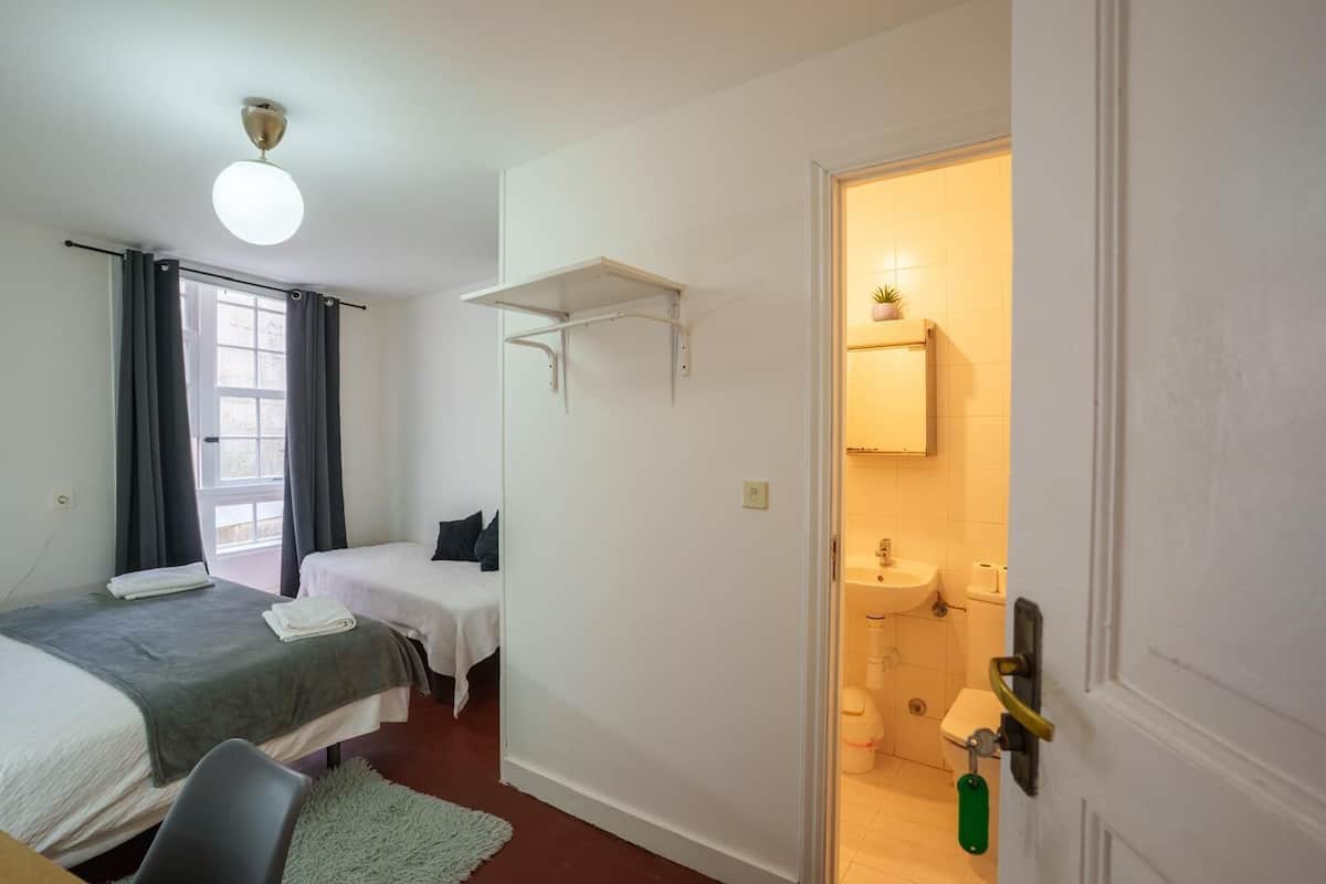 Desk, laptop workspace, free WiFi, bed sheets