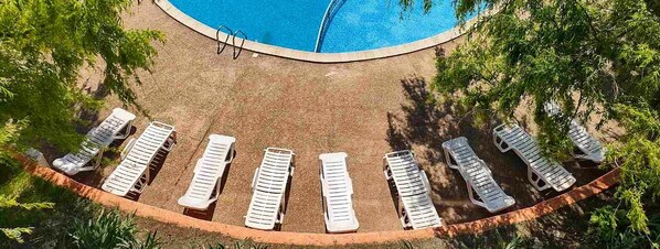 Seasonal outdoor pool, open 8:00 AM to 8:00 PM, pool umbrellas