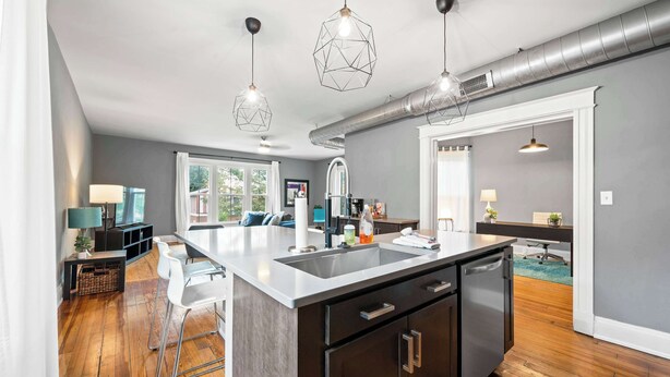 A modern kitchen with a central island, stainless steel appliances, and pendant lighting. - 8 min to Stadiums & Dwntn Cincy, 1BR in Ludlow KY (Ludlow)