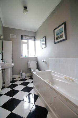 Separate tub and shower, deep soaking tub, hair dryer, towels