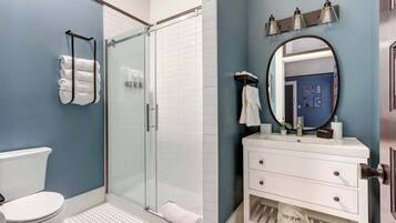 Shower, hair dryer, towels, shampoo