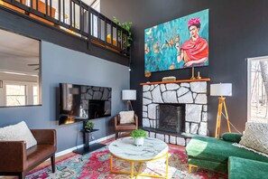 TV, fireplace, books