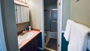 A bathroom with a sink, mirror, and towel rack. - #168 Condo near large pool & shuttle to Gorge Amp-book separately (Quincy)