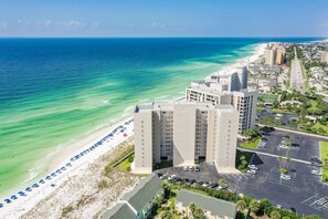 A coastal hotel with a beach view, parking, and a road leading to the beach. - 🌅Beach Front with 180 degree Views~Shoreline 2086 (Destin)