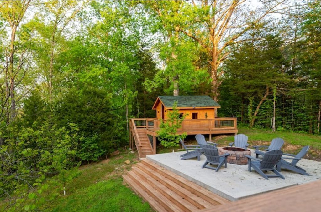 Yard by firepit and tree house