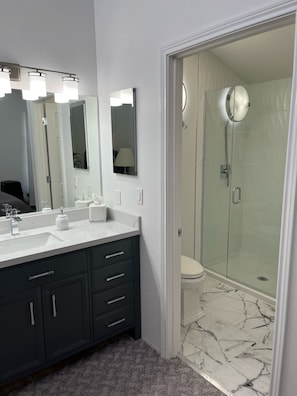Shower, hair dryer, towels, soap