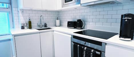 Apartment, 1 King Bed | Private kitchen | Fridge, microwave, oven, stovetop