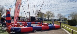 Children can play safely in the enclosed water play area with multiple slides and climbing elements.