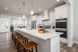 Fridge, microwave, oven, stovetop - Newly built end unit townhouse with Pond views in The Peninsula! (Millsboro)