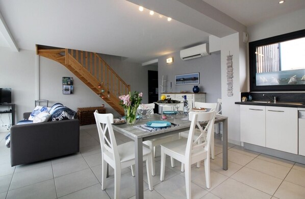 Enjoy meals in the dining area, relax on the sofa, and unwind with a flat-screen TV.