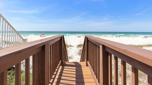 A wooden boardwalk leading to a beach with clear skies. - Gulf Front 3bd/2ba Home With Private Beach Access! (Panama City Beach)