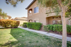 Stunning residential building with a central entrance and beautifully manicured lawn.