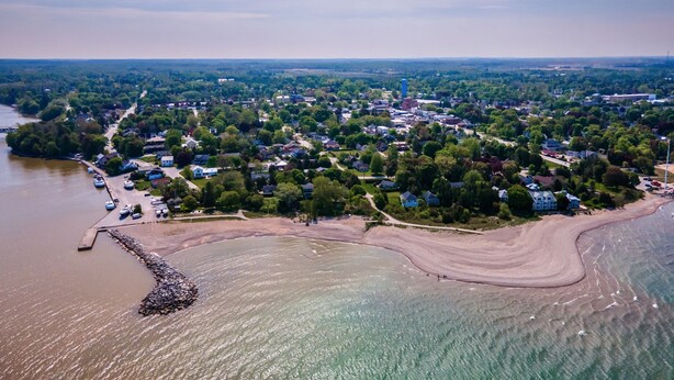 An aerial view of a coastal town with a marina, residential areas, and a beach. - GLOBALSTAY Brand New House in Port Elgin (Saugeen Shores)