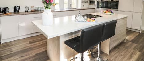 Fridge, electric kettle, toaster, cookware/dishes/utensils