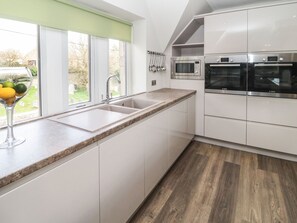 Fridge, electric kettle, toaster, cookware/dishes/utensils