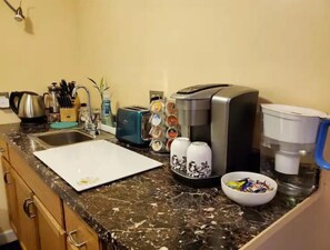 Fridge, microwave, coffee/tea maker, toaster