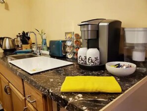 Fridge, microwave, coffee/tea maker, toaster