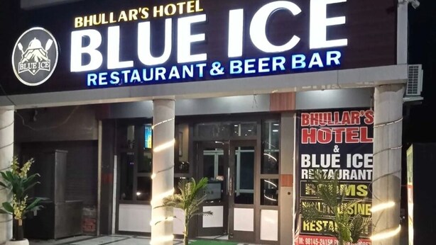 Bhullar's Hotel & Blue Ice Restaurant & Beer Bar with a prominent illuminated sign. - Hotel Bhullar (Amritsar)