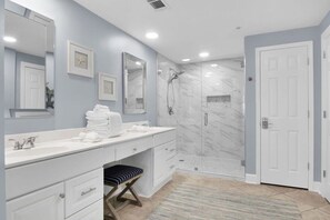 Shower, hair dryer, towels, shampoo