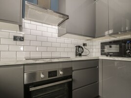 Fridge, electric kettle, toaster, cookware/dishes/utensils