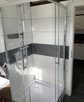 Shower, hair dryer, towels, soap